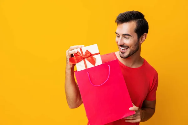Man lifestyle discount women holiday gift happy present surprise purchase sale package client bag yellow isolated store buy shopper fashion shop day