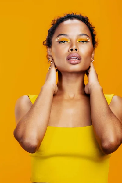 Skin woman space face model copy studio beautiful cosmetology black portrait make-up yellow smile cosmetic fashion beauty style creative african colourful