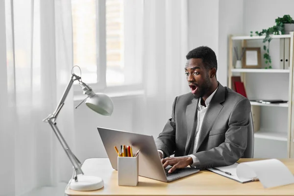 man person manager american african businessman smiling office computer desk freelancer education indoor sitting laptop freelance online corporate american job student african