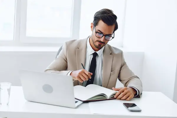 Technology man smart corporate suit confident holding paper company successful concept shirt modern document happy laptop planning expertise winner office person manager businessman