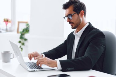 Man tired office glasses confused suit thinking employee working workplace sitting stressed looking hands expression business desk manager laptop clipart