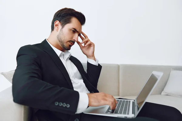 Man sofa suit office sitting using attractive working businessman looking relaxation worker call smart video home portrait freelance computer job laptop