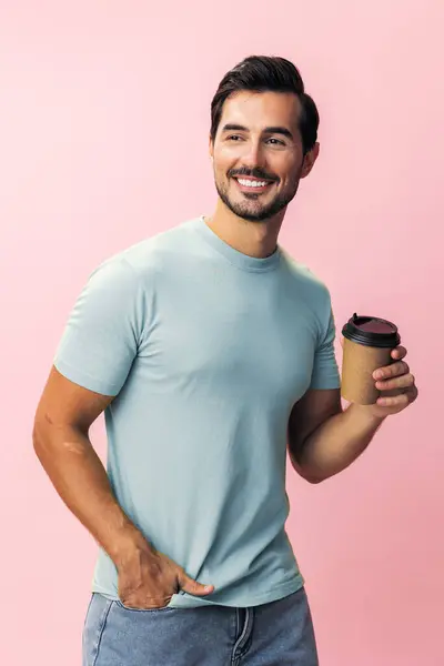 Man tea coffee cup smile model sleep studio pink drink fashion space hot t-shirt insomnia mug background student happy paper copy isolated hipster energy