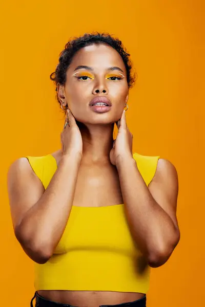 Style woman portrait black face beauty skin smile make-up cosmetic model african cosmetology yellow studio colourful fashion creative beautiful