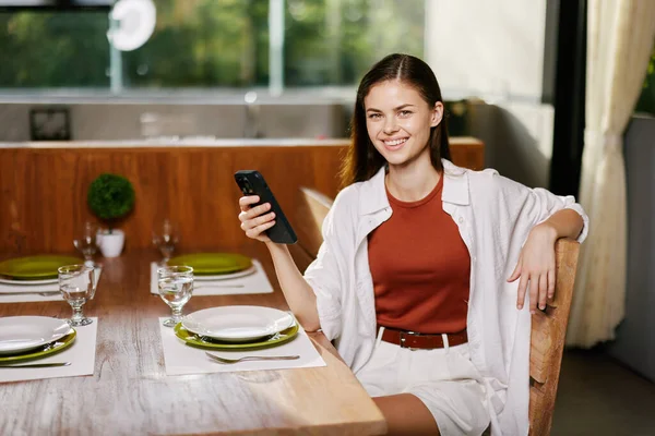 Mobile women technology phone cafe sitting using smartphone female communication beauty adult lifestyle attractive lady young portrait caucasian business person