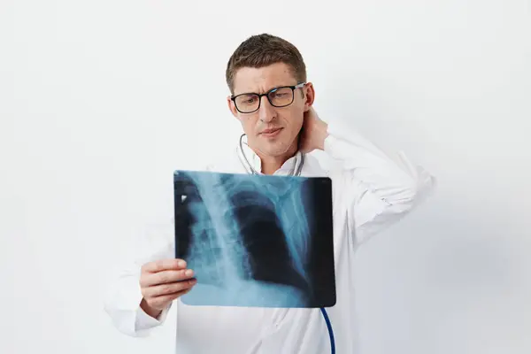 Man hospital diagnosis doctor radiography looking medic radiologist professional person man physician healthcare clinic stethoscope x-ray specialist medicine health radiology