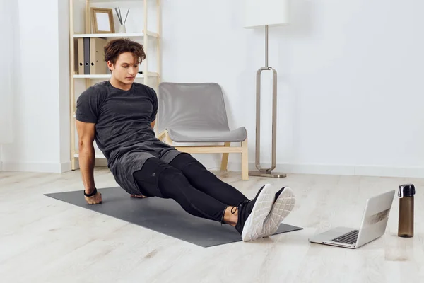 house man exercising healthy sporty home floor activity health training sportswear exercise indoor strength exercise lifestyle gym physical young athlete sport person