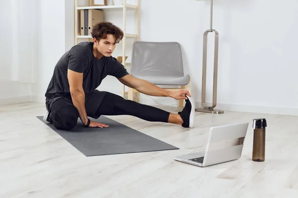 man person laptop exercise indoor training sporty lifestyle home living exercising sport muscle room healthy yoga health male quarantine house abs activity