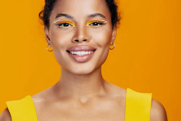 stock image Yellow woman face fashion style colourful skin beauty black smile portrait beautiful african copy cosmetology creative space model make-up studio cosmetic