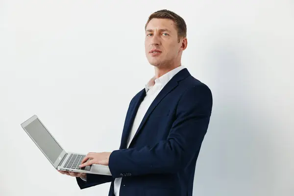 Modern man office looking business young laptop adult man handsome technology computer sitting job caucasian table desk portrait working professional person businessman