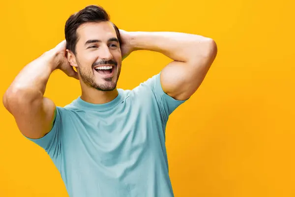 Man style confident model lifestyle laughing smile fashion copy space gesture cheerful isolated studio trendy arm yellow background portrait guy smiling