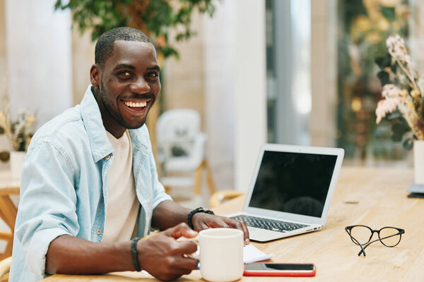 African man guy computer laptop smile black work professional business businessman communication lifestyle technology happy student online office young person male adult american