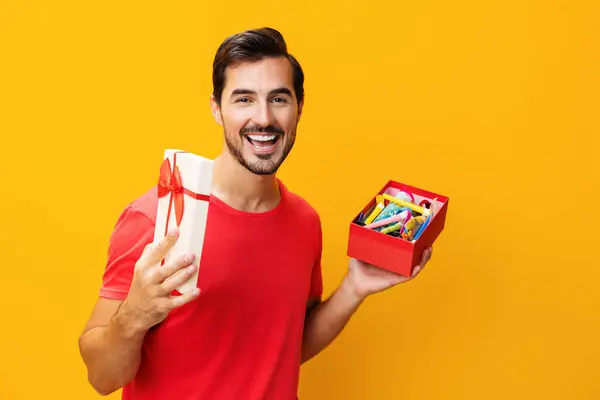 Isolated man birthday holding fashion box sale happy guy male studio box christmas space copy celebration holiday gift surprise model valentine give gift party celebrate present