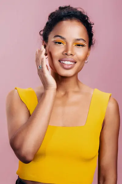 Yellow woman ethnic space face happy eye fashion colourful beautiful beauty make-up skin african black smile copy model portrait style studio cosmetology cosmetic pink creative