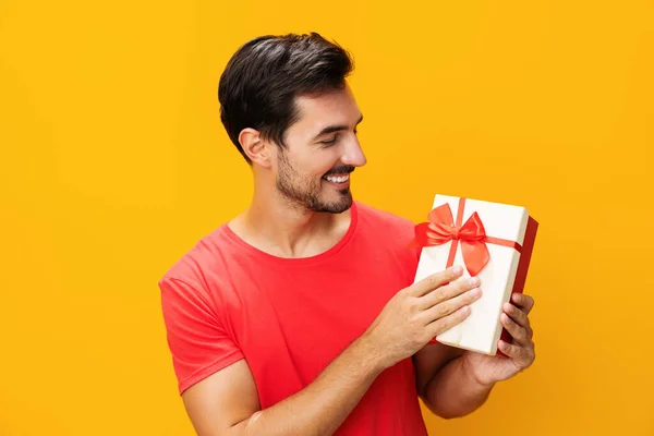 Sale man model gift studio party copy birthday holiday surprise happy male guy celebration space give present celebrate christmas valentine gift holding box box