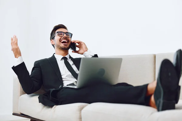 Suit man sitting corporate businessman video office phone conversation occupation smile adult connection entrepreneur attractive winner laptop talk manager computer call