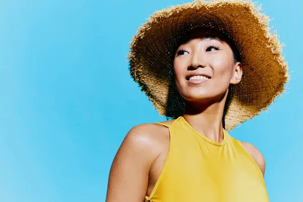 Yellow woman pretty portrait excited beauty one swimsuit joy smile wow female fashion young blue casual hat expression trendy shocked summer attractive fun mouth