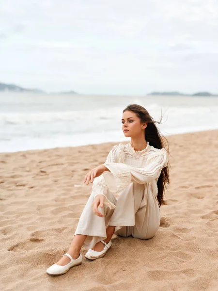 Seaside Serenity: A Alluring Caucasian Lady, Radiating Beauty and Joy, Embraces the Warmth of Summer on a Sunny Beach, Amidst the Splendor of Nature and the Azure Waters of the Ocean.