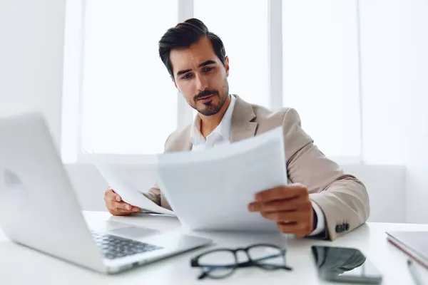 Corporate document happy laptop businessman attractive suit worker employee successful company holding success white business planning communication office paper