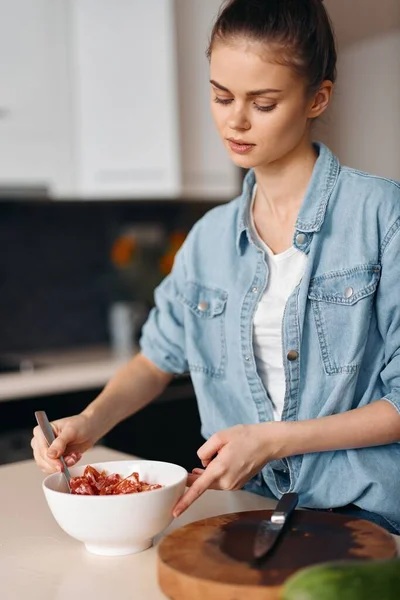 Kitchen Beauty: Young Female Cook prepares Healthy Vegetarian Salad at Home
