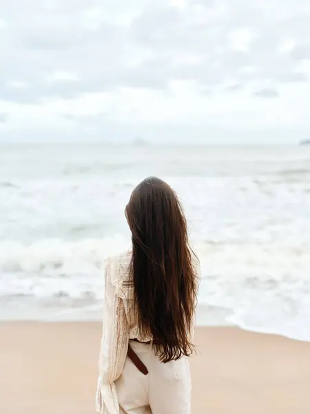Solitude by the Sea: A Contemplative Womans Melancholy on the Beach