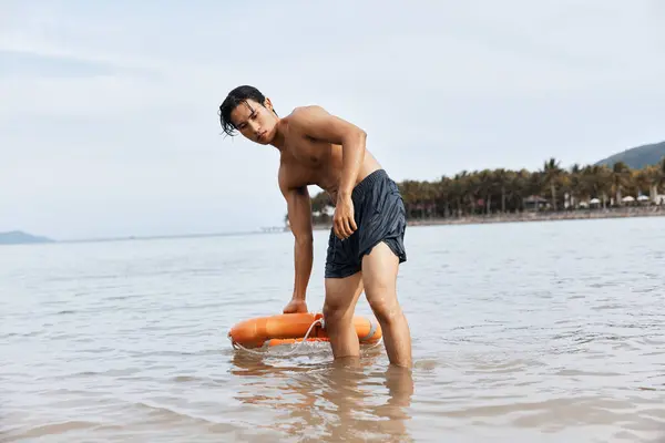Guardian of the Seas: A Vigilant Lifeguard Ensuring Safety and Joy on the Asian Beach