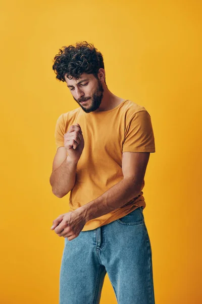 Man model expression yellow hand cool background person guy fashion standing caucasian beard portrait gesture studio adult young handsome white isolated casual face