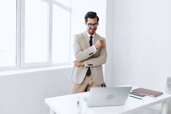 Person man looking portrait emotion workplace winner business job technology businessman sitting laptop winning executive gesturing suit happy office