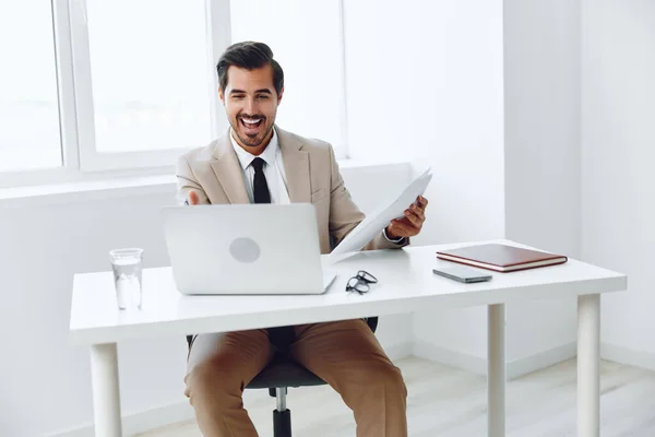 Corporate man workplace confident job planning businessman communication document holding shirt successful paper caucasian positive expertise male young company suit office happy laptop