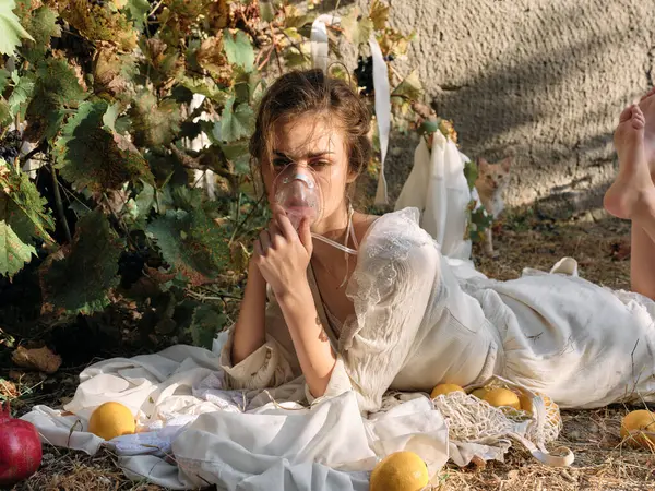 stock image Sensational woman in white dress surrounded by fresh lemons and fruit on the ground