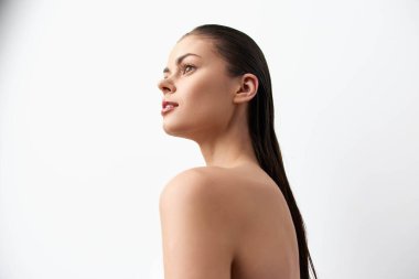 This image features a young woman with wet hair, showcasing her side profile against a clean white background The minimalist style emphasizes her natural beauty and elegance, representing purity and clipart