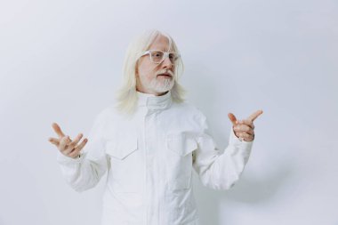 elderly man with long white hair wearing a stylish white jacket, gesturing warmly against a clean, minimalistic white background, representing wisdom, experience, and positivity in a modern context clipart