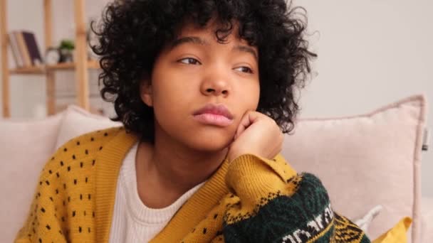 African American Sad Thoughtful Pensive Unmotivated Girl Sitting Sofa Home — Stockvideo