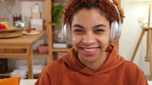 Beautiful African American Girl Afro Hairstyle Wearing Headphones Smiling Home — Wideo stockowe