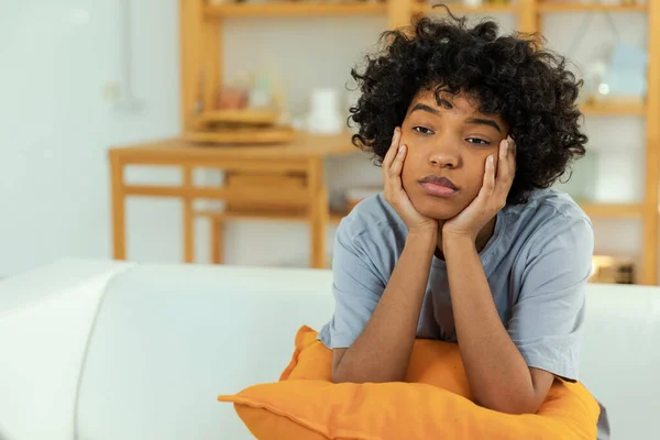 stock image African american sad thoughtful girl at home. Young african woman feels depressed offended lonely upset suffers from abuse harassment heartbreak. Grieving violence victim has psychological problem