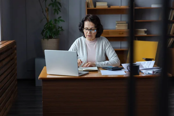 Middle Aged Senior Woman Sit Laptop Paper Document Pensive Older — Stockfoto