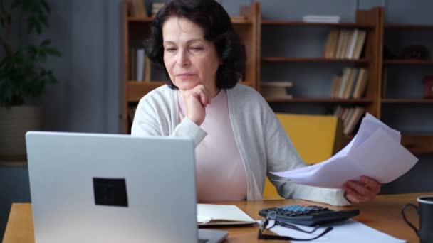 Middle Aged Senior Woman Sit Laptop Paper Document Pensive Older — Stok Video