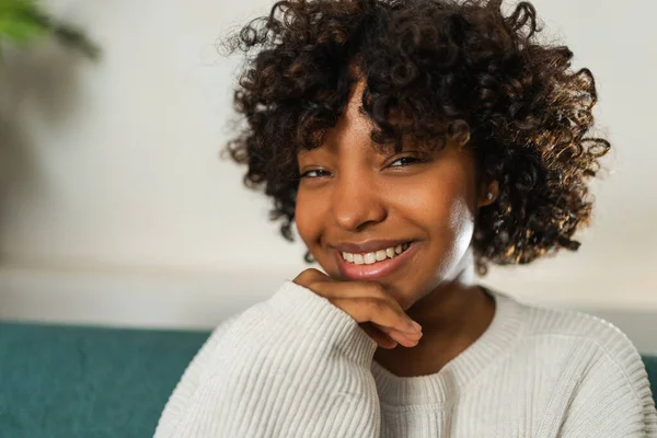 Beautiful african american girl with afro hairstyle smiling. Close up portrait of young happy girl. Young african woman with curly hair laughing. Freedom happiness carefree happy people concept