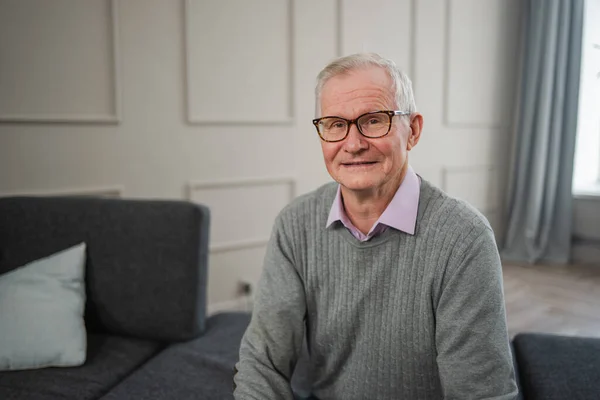 stock image Portrait of confident stylish European middle aged senior man at home. Older mature 70s man smiling. Happy attractive senior grandfather looking camera close up face headshot portrait. Happy people