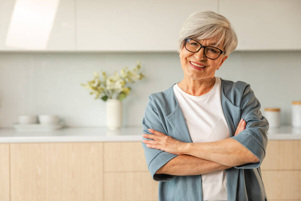 Portrait of confident stylish european middle aged senior woman. Older mature 60s lady smiling at home. Happy attractive senior female looking camera close up face headshot portrait. Happy people