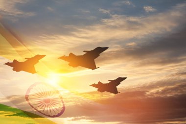 Indian Air Force Day. Indian jet air shows on background of sunset with transparent Indian flag. Commemorate Indian Air Force Day on October 8 in India.