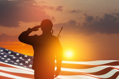 USA army soldier saluting with nation flag on a background of sunset or sunrise. Greeting card for Veterans Day, Memorial Day, Independence Day. America celebration. 3D-rendering.