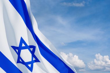 Israel flag with a star of David over cloudy sky background. Patriotic concept about Israel with national state symbols. Banner with place for text.