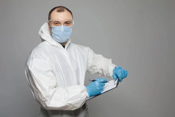 Scientific Virologist Biologist Protective Suit Blue Gloves Takes Notes Viruses — Stock Photo, Image