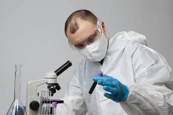 Scientific Virologist Biologist Protective Suit Blue Gloves Holds Test Tube — Foto Stock