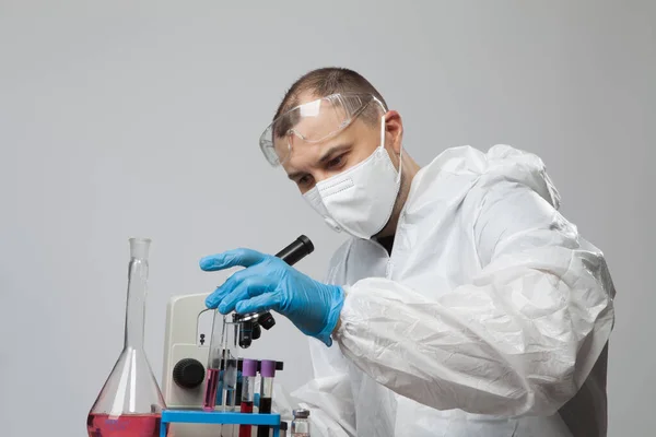 Scientific Virologist Biologist Protective Suit Blue Gloves Using Microscope Viruses — Stock Photo, Image