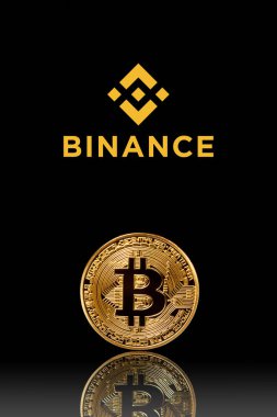 Binance logo with bitcoin on black background. Binance - one of the largest cryptocurrency exchange on the market. Moscow, Russia - November 1, 2022.
