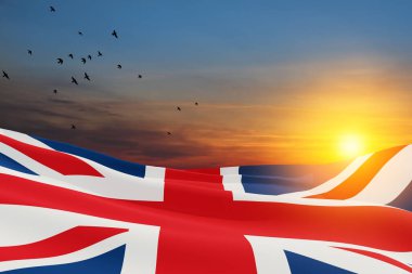 National flags of United Kingdom with flying birds on sunset sky background. Background with place for your text. 3d rendering.