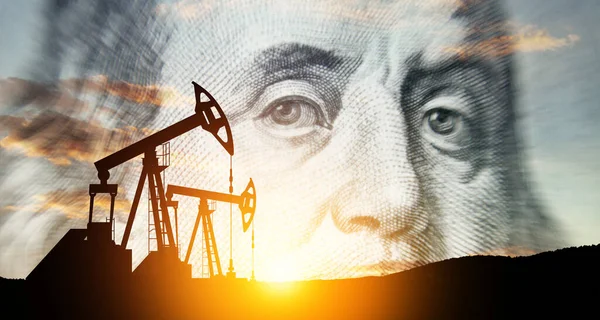 Oil price cap concept. Petroleum, petrodollar and crude oil concept. Oil pump on background of US dollar. Dollar and oil pumps