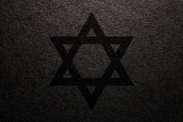 Holocaust Remembrance Day. Star of David on a black background. Holocaust Remembrance Day Poster, January 27.